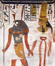 an egyptian painting with two men holding hands