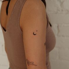 a woman with a small tattoo on her arm