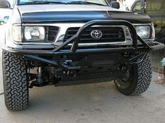 a black and silver truck parked in front of a building