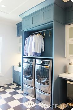 a washer and dryer in a room with checkered flooring on the floor