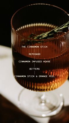 a close up of a drink in a glass on a table