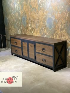 a large wooden cabinet sitting in front of a wall