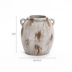 Capture the timeless beauty of this 11.8-inch tall mottled brown and white terracotta jug vase. With its handcrafted vintage appeal, this vase adds an irresistible charm to both indoor and outdoor spaces. Whether your decor is Bohemian, farmhouse, or modern, this vase seamlessly complements any style. Its exquisite design features two small handles that enhance visual interest and impart a unique character. Perfect for solo display or as part of a collection, this vase will stand out in your living room, bedroom, or patio, adding a natural and soothing presence to your environment.","This 11.8-inch tall mottled brown and white terracotta jug vase with a handcrafted vintage appeal adds charm to indoor and outdoor spaces. The vase complements various decor styles, features two small handles, Outdoor Vases, Vase With Handles, Ancient Mediterranean, Bohemian Farmhouse, Grand Vase, Outdoor Accent Table, Jug Vase, Outdoor Accents, Modern Vase