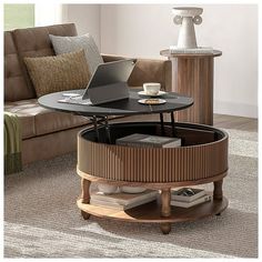 The Round Coffee Table is a stylish and practical addition to any living room. With its lift top design, it allows you to work, write, or dine comfortably on the sofa. The table's mid-century modern style adds a retro feel to any space, making it a perfect fit for both contemporary and traditional dcor.Measuring 31.5" in diameter, this coffee table is compact in size, making it suitable for smaller living rooms or apartments. Despite its small footprint, it offers ample storage options. The table features a 2-tier structure with hidden storage space inside the lift top, allowing you to store items like magazines, remote controls, and other essentials out of sight. Additionally, the open storage space at the bottom provides extra room for books, snacks, or decorative trinkets, helping you k Wood Circle Coffee Table, Small Center Table, Apartment Gadgets, Round Coffee Table With Storage, Living Room Walnut, Circle Coffee Table, Mid Century Modern Storage, Door Coffee Tables, Circle Coffee Tables