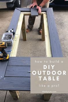 a man standing next to a table with tools on it and the words how to build a diy outdoor table like a pro