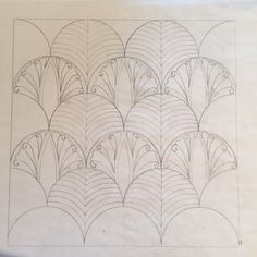 a drawing of an art deco fan pattern on white paper with black ink in it