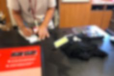 a blurry image of a person using a laptop computer on a desk in an office