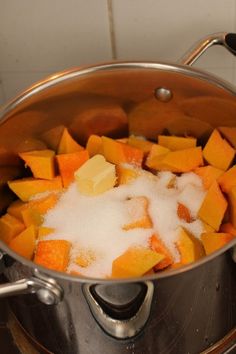 a pot filled with sugar and cubed sweet potatoes