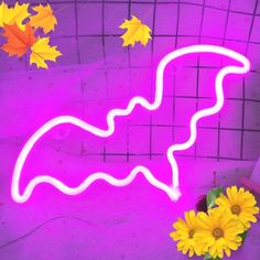 a purple neon sign with yellow flowers and leaves