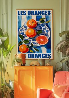 an orange poster hangs on the wall above a yellow cabinet