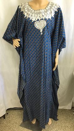 Vintage: 1960s 70s Caftan "Kaftan" Size: Medium Large Materials: Poly cotton blend  Color: Blue geometric Print Description:  Vintage Kaftan Maxi Dress.  Blue and Gold Geometric Print. Pretty white embroidery around neck line.  Very Slimming look.  High Neck.  Slip on No Zipper.   Great style wonderful look. Condition: Excellent. no tears or smells.  Please see pictures for more details Size: Not marked - Fits size small to large. Note: Slip on only No zipper.   This Kaftan is made to be more form fitting.  There is several inches of material on the outside to give it the free flowing look but is form fitting.  I have taken a picture of the dress "inside out"  To give a better idea of the fit. This is the LAST picture Please see measurements for proper fit Measurements: Shoulder 19" Chest Festive Blue V-neck Kaftan, Festive Blue Kaftan With Kimono Sleeves, Blue Long Free Size Kaftan, Blue Maxi Dress With Dabka Details, Bohemian Blue Floor-length Kurta, Blue Dabka Maxi Dress, Blue Floor-length Dress With Dabka, Bohemian Maxi Dress With Dabka, Festive Tunic Kaftan With Block Print