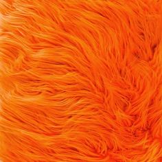 an orange furry animal fur texture close up