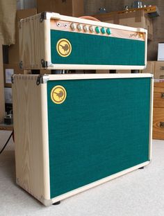 two amps sitting side by side on the floor