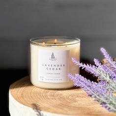 a lavender candle sitting on top of a wooden table