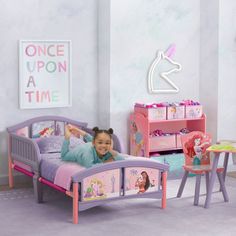 Your little one will relax like royalty with this Disney Princess Plastic Toddler Bed by Delta Children. © Disney Your little one will relax like royalty with this Disney Princess Plastic Toddler Bed by Delta Children. © Disney Two attached guardrails with low to the ground design Sturdy steel frame and high-quality Enables safe and easy access in and out of bed Colorful decals of everyone's favorite Disney princesses, Ariel, Rapunzel and Moana Bed's low mattress height and attached guardrails make it the best option for your child's first big-kid bed Bedding & mattress sold separately Easy assembly Uses a standard crib mattress (sold separately) Imported 90 day limited parts only Model no. BB81482PS-1038 Maximum weight capacity: 50 lbs. Wipe clean Plastic Assembly required Assembled: 53.9 Boho Girls Room, Ground Design, Kid Bed, Girl Room Inspiration, Fairy Lights Decor, Unicorn Bedroom, Big Kid Bed, Pink Bedroom Decor, Princess Room