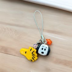 a keychain with two cartoon characters on it