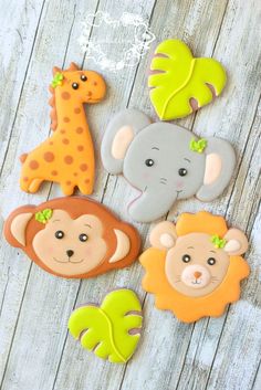 some cookies are decorated with animals and plants