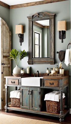 a bathroom with a sink, mirror and two baskets on the counter in front of it