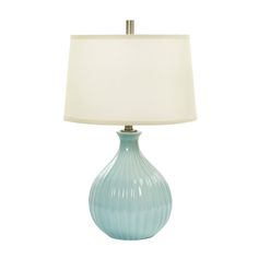 a blue lamp with a white shade on it