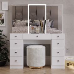 a white dressing table with mirror and stool