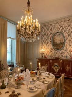 a fancy dining room set up for dinner