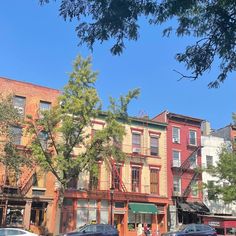 cars are parked in front of buildings on the street