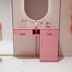 there is a pink vanity and mirror in the room