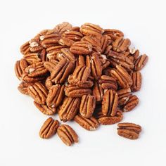 a pile of pecans on a white background