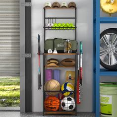 a rack filled with sports equipment next to a garage door