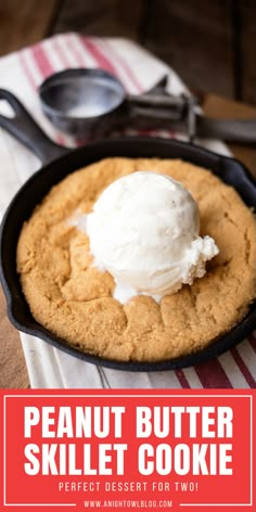 peanut butter skillet cookie in a cast iron pan with vanilla ice cream on top