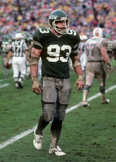 a football player is walking on the field