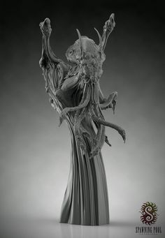 a statue is shown in black and white, with the image of an alien like creature