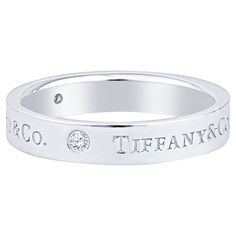 This classic band ring features 3 round brilliant diamonds and Tiffany & Co. engraving. It is 4mm wide and set in platinum. It measures a size 7.75. Condition: Excellent. Previously owned, like new or lightly worn, with no signs of use and is in perfect condition. Tiffany T Ring Silver, Tiffany & Co Rings, Tiffany And Co Silver Ring, Tiffany Engagement Ring Tiffany & Co., Luxury Rings Tiffany & Co., Tiffany Co Rings, Tiffany Rings, Tiffany And Co, Brilliant Diamond