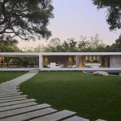 a modern house with stone steps leading up to it