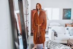 JEDI KNIGHT STYLE COMFORT Whether you're a young Padawan learner or fully realized Master of the Force, this Jedi Master Adult Bathrobe will serve you well. Fashioned after the traditional robes of a Jedi Knight, the highly detailed designs feature an embroidered Jedi Order insignia and a lightsaber hilt at hip. Made of 100% soft-touch polyester fleece material, this Star Wars shower robe is created for pure relaxation after a long day of honing your lightsaber skills. As a guardian of peace and Star Wars Marathon, Star Wars Jewelry, Lightsaber Hilt, Star Wars Fashion, Star Wars Wedding, Jedi Order, Star Wars Costumes, Jedi Master, Jedi Knight