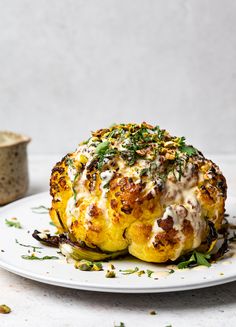 a white plate topped with bread covered in cheese