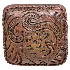 an intricately carved leather square case