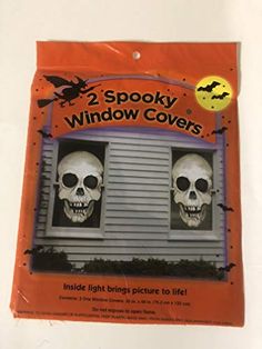 two spooky window covers with skeleton heads