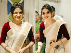 two women in sari standing next to each other