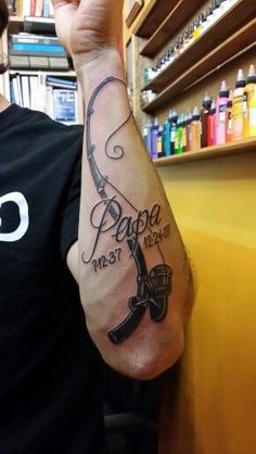 a man with a tattoo on his arm