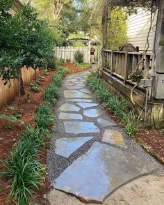 a stone path in front of a house