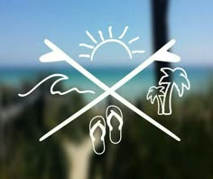 there is a window with some stickers on it that say beach and palm trees