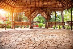 the inside of a building that is made out of dry grass