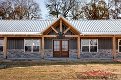 a house with a metal roof and two windows