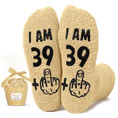 a pair of slippers that say i am 39 and have thumbs up