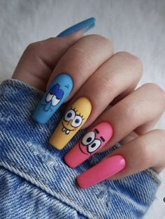 someone has painted their nails with cartoon characters