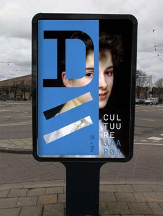 a sign on the side of the road that says d is for girl with blue hair