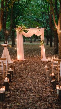 an outdoor wedding set up in the woods