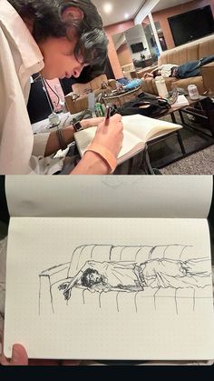 a person is writing on a piece of paper while another person looks at the drawing