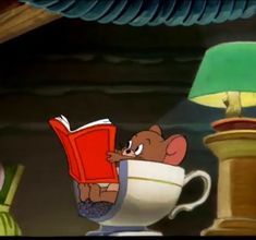 a cartoon mouse reading a book in a teacup with a lamp on the side